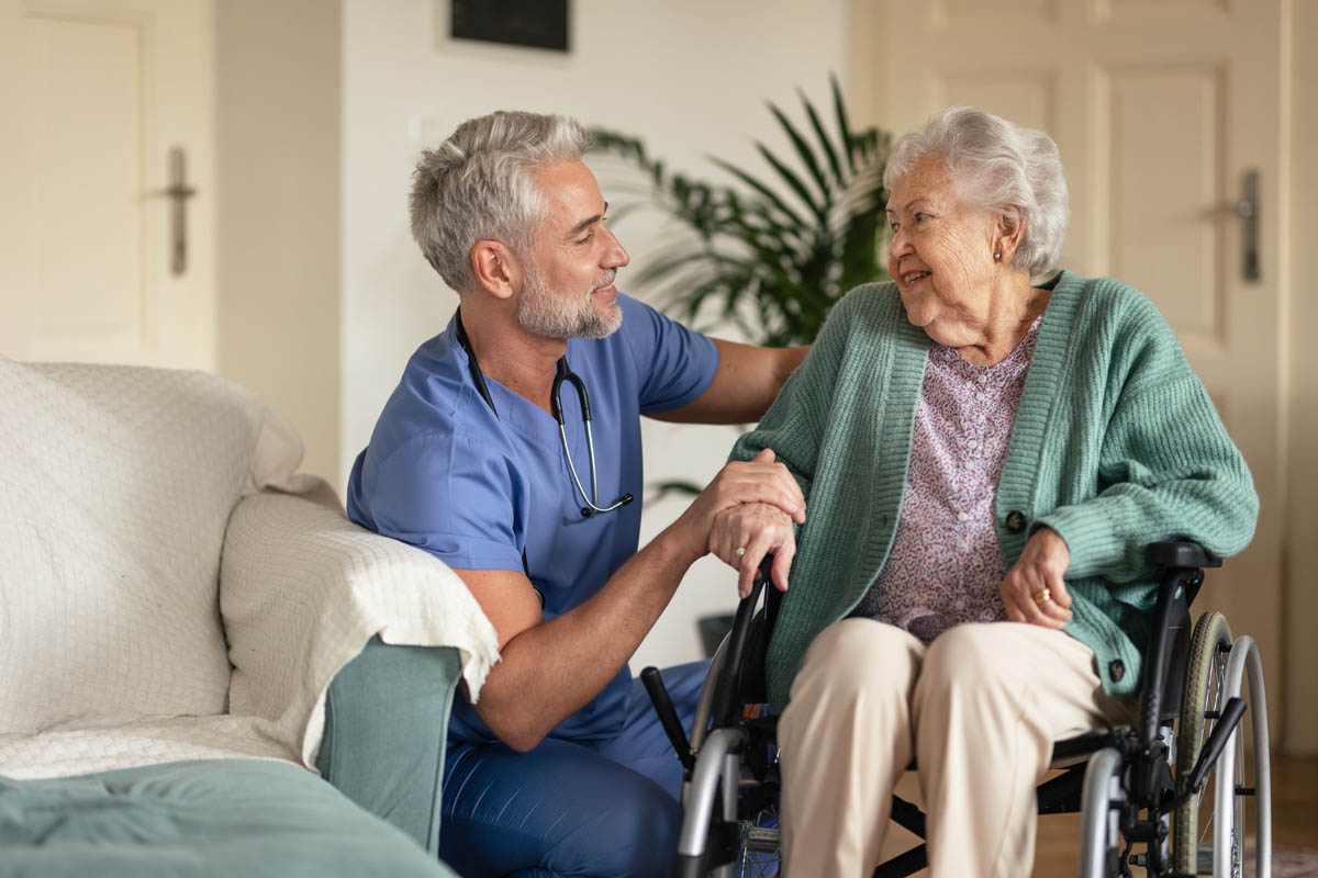 Caregiver doing regular check-up of senior woman in her home. a caregiver checks on a senior in an assisted living community