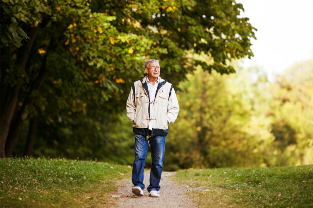 Senior walking for wellness on a cool day